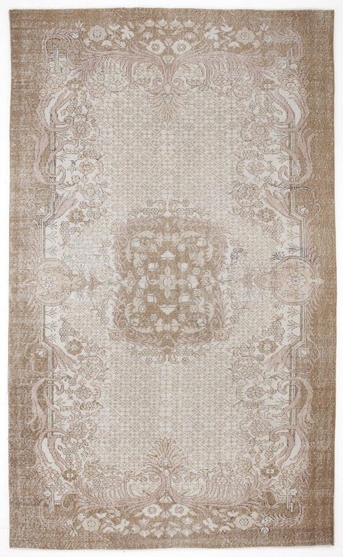 Load image 1 in gallery view. Tan and cream vintage-style rug with a central medallion and ornate floral border on a white background.