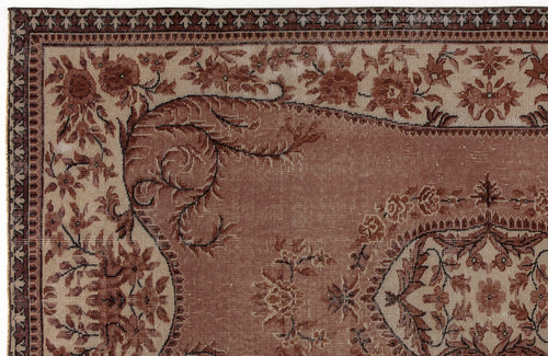 Load image 1 in gallery view. Terracotta and beige traditional rug with a floral medallion pattern and intricate geometric border.