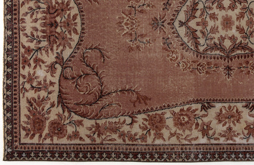 Load image 1 in gallery view. Terracotta and beige traditional rug with a distressed floral medallion pattern and a detailed geometric border.