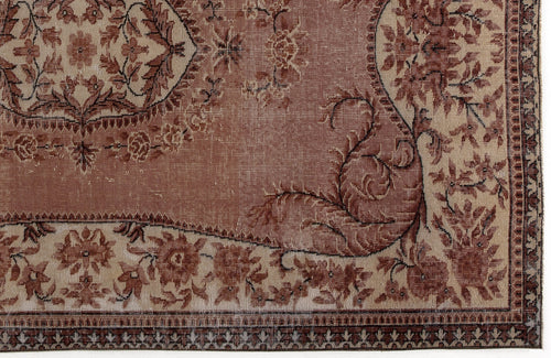 Load image 1 in gallery view. Terracotta and beige traditional rug with a floral medallion pattern and a detailed geometric border.
