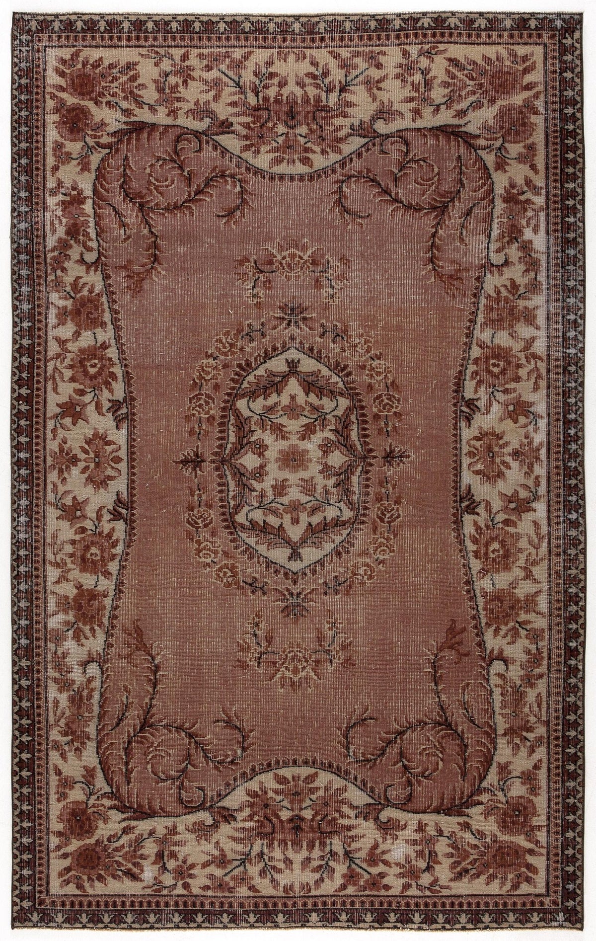Dusty rose and beige traditional rug with a central floral medallion and ornate botanical border.