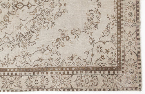 Load image 1 in gallery view. Beige and brown rug with a traditional floral vine pattern and a geometric border on a white background.