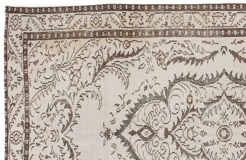 Load image 1 in gallery view. Beige and brown traditional rug with a detailed floral medallion pattern and geometric border.