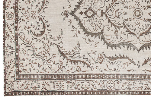 Load image 1 in gallery view. Cream and brown rug with a distressed traditional medallion pattern and a geometric border.