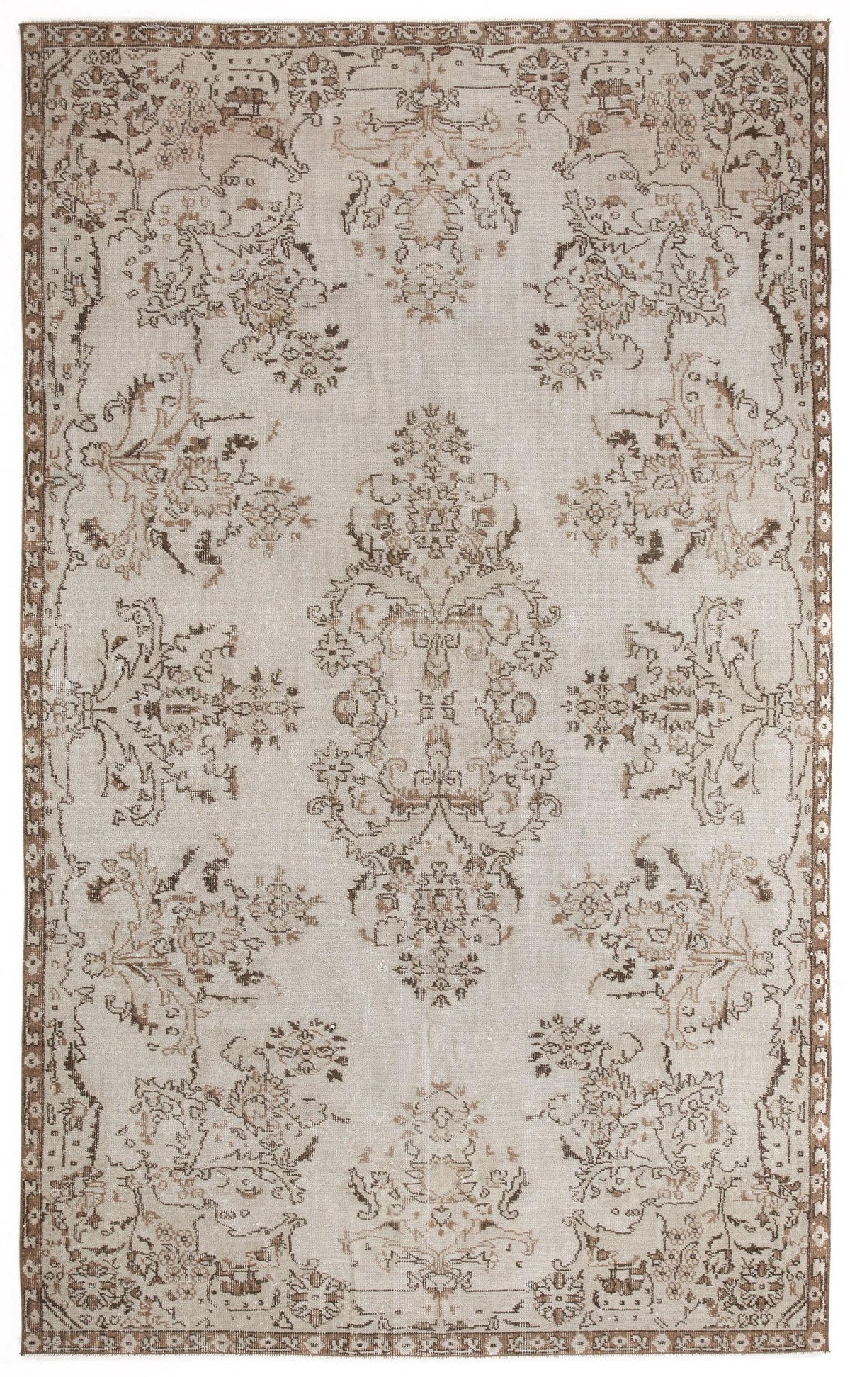 Beige and brown vintage-style rug with a distressed floral medallion pattern and a decorative border.