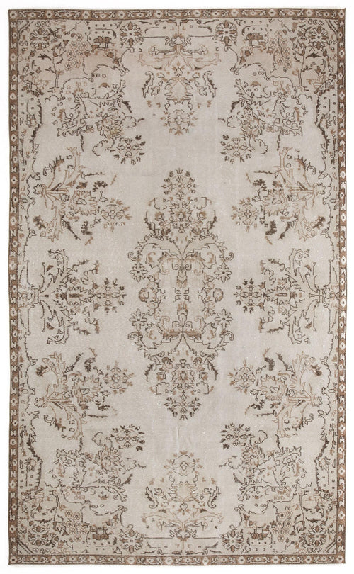 Load image 1 in gallery view. Beige and brown vintage-style rug with a distressed floral medallion pattern and a decorative border.