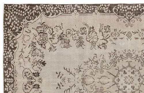Load image 1 in gallery view. Taupe and dark brown rug with a traditional floral medallion pattern and decorative border.