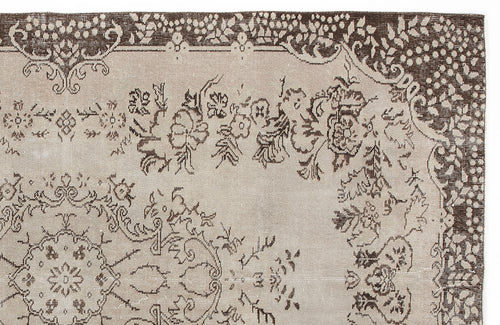 Load image 1 in gallery view. Beige and dark brown traditional rug with a floral medallion and ornate border pattern.