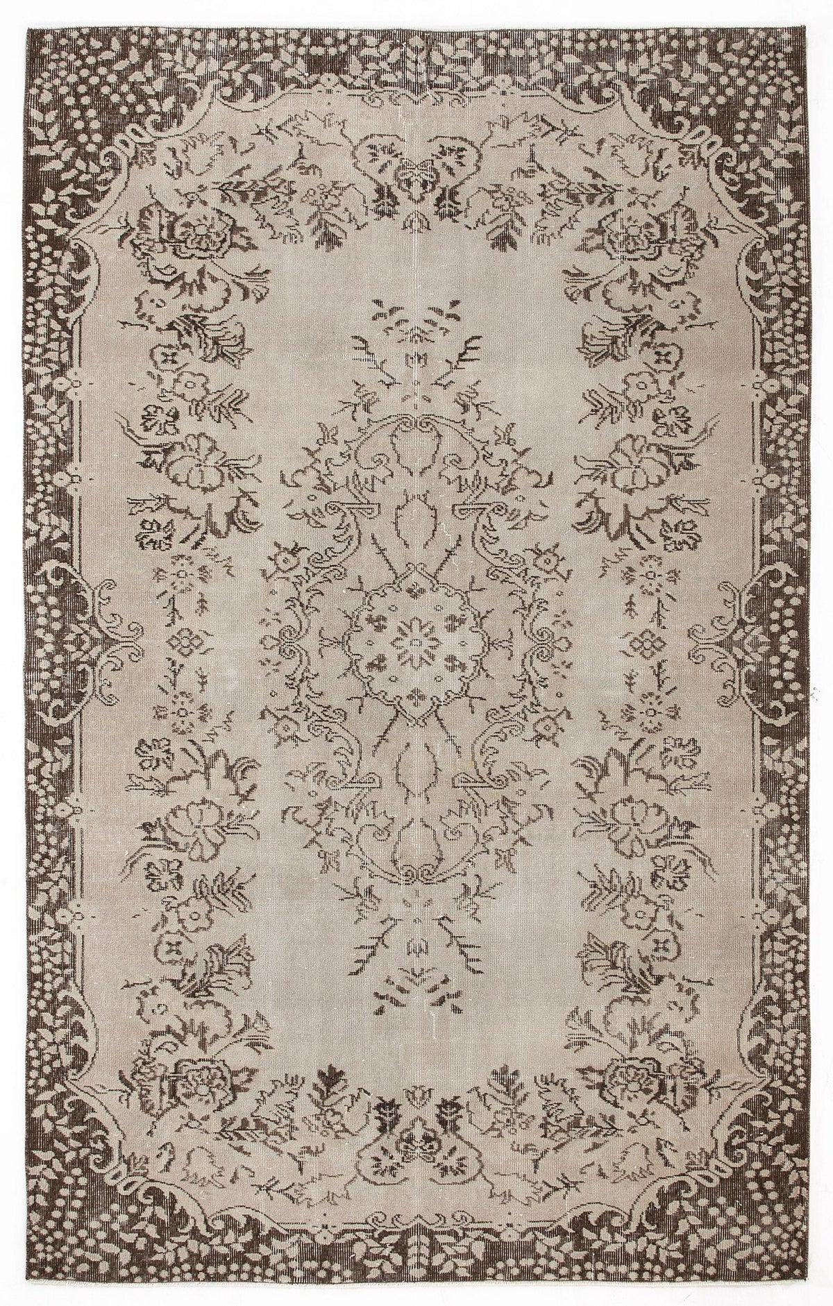 Taupe and dark brown vintage-style rug with a central floral medallion and ornate botanical border.
