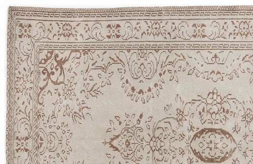 Load image 1 in gallery view. Beige and brown rug with a traditional floral medallion pattern and a detailed border.