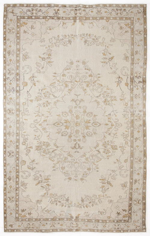 Load image 1 in gallery view. Beige and tan distressed vintage-style rug with a central floral medallion and a decorative border.