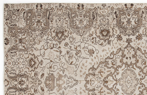 Load image 1 in gallery view. Beige and brown rug with a distressed, traditional floral medallion pattern.