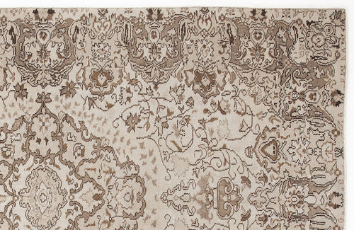 Load image 1 in gallery view. Beige and brown rug with a distressed, traditional floral medallion pattern.