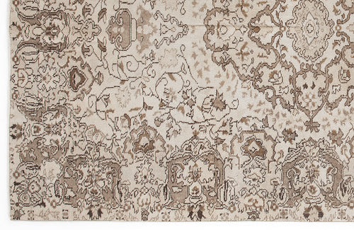 Load image 1 in gallery view. Beige and taupe rug with a distressed, traditional Persian-style floral medallion pattern.