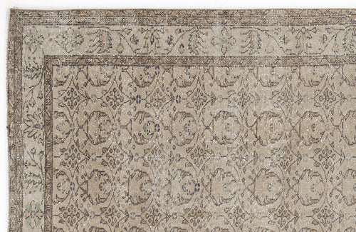 Load image 1 in gallery view. Beige and taupe vintage-style rug with a distressed floral medallion pattern and a detailed border.