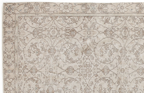 Load image 1 in gallery view. Beige and taupe traditional rug with a distressed floral medallion pattern and a decorative border.