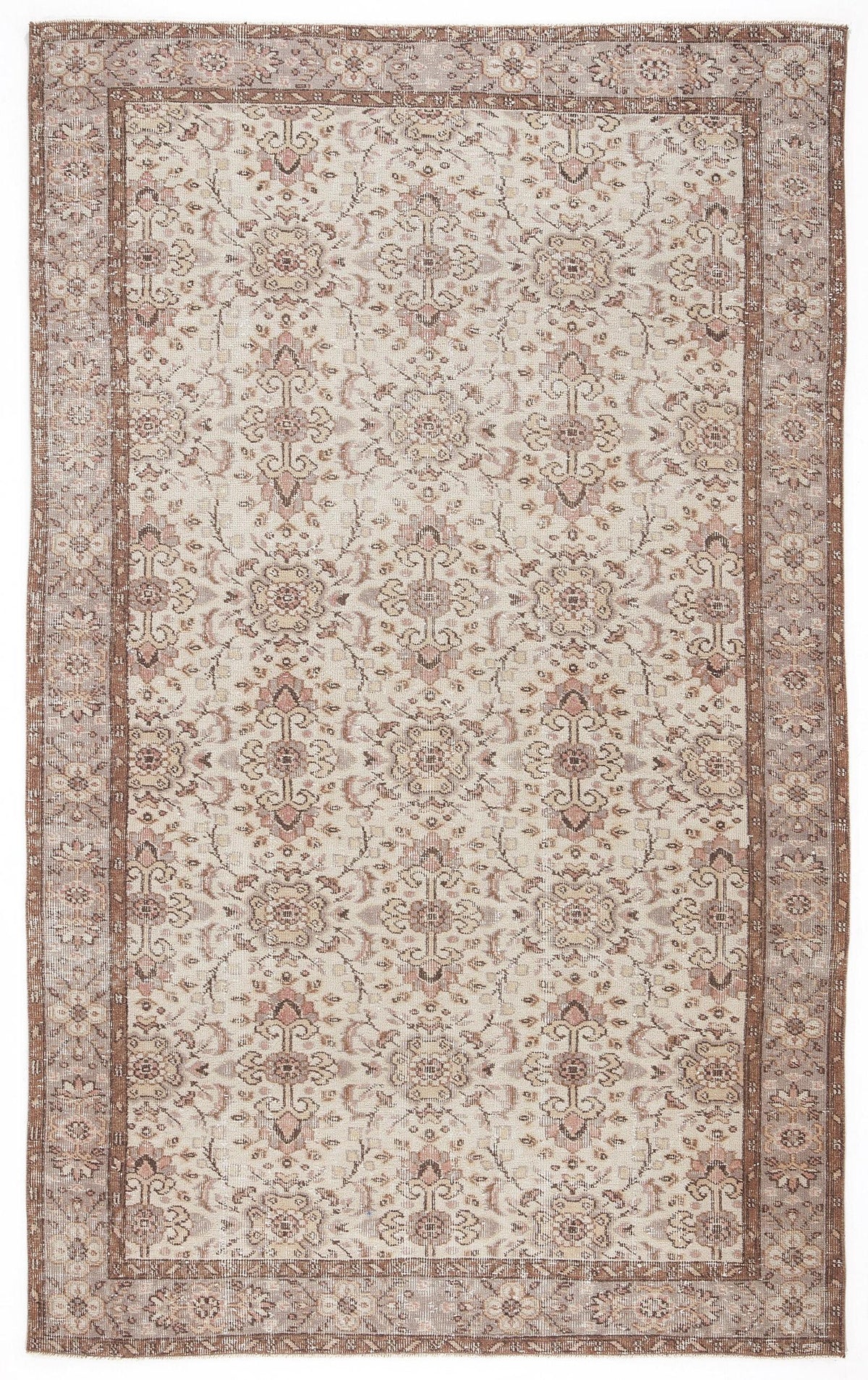 Beige and muted rose vintage-style rug with a traditional floral medallion pattern and a wide decorative border.