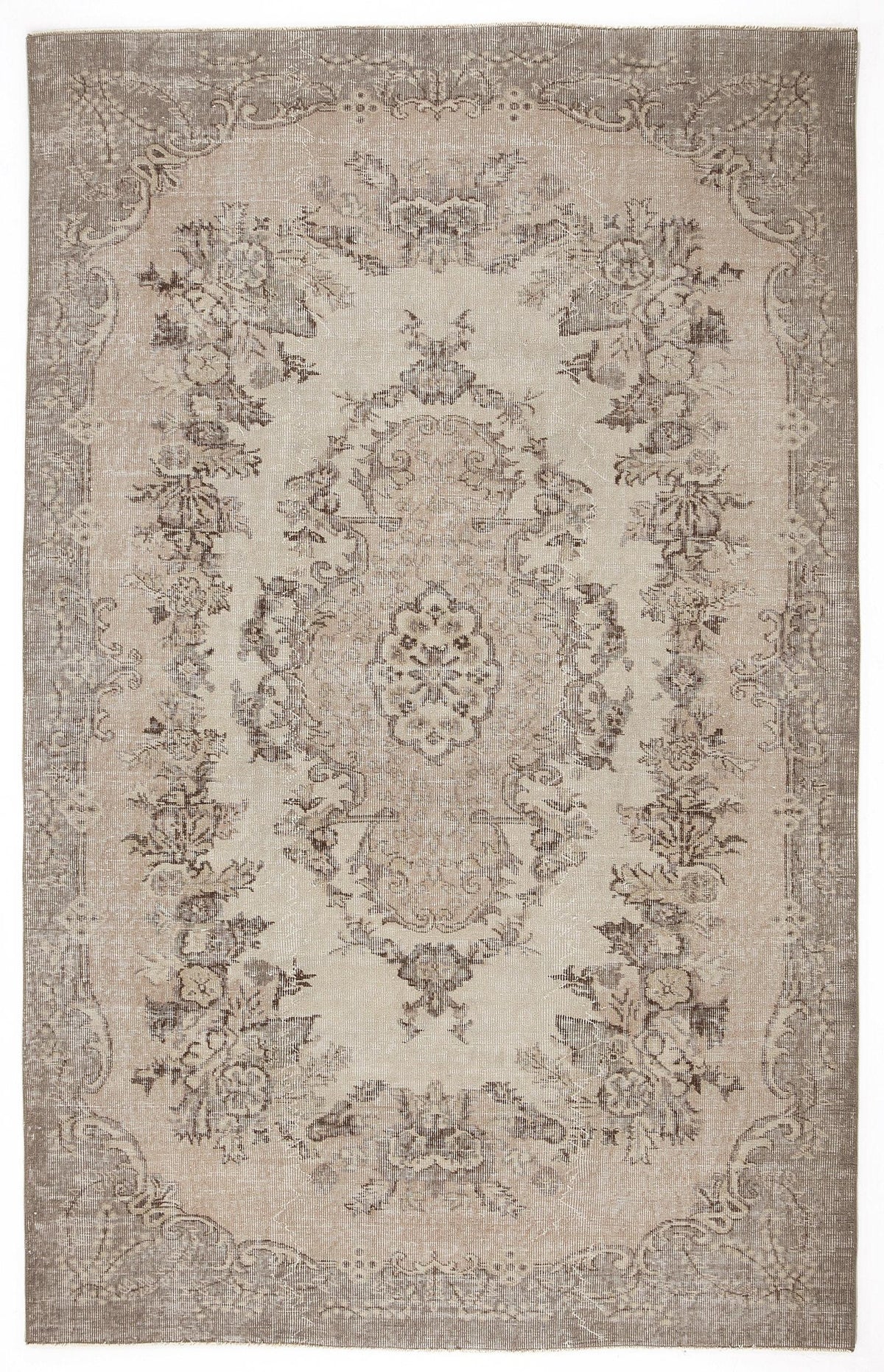 Taupe and beige distressed rug with a traditional floral medallion pattern and ornate border.