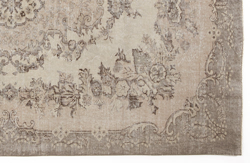 Load image 1 in gallery view. Taupe and beige rug with a distressed traditional floral medallion pattern and a wide decorative border.