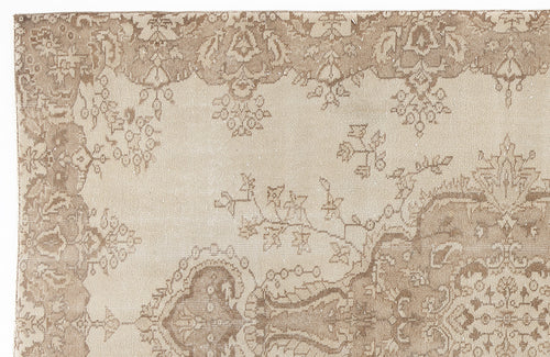 Load image 1 in gallery view. Beige and taupe rug with a distressed traditional floral medallion pattern on a white background.