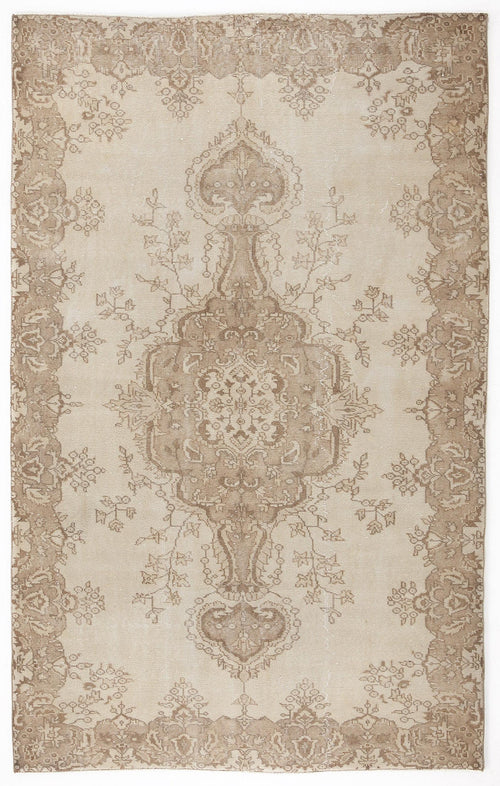 Load image 1 in gallery view. Beige and taupe vintage-style rug with a central floral medallion and ornate border on a white background.