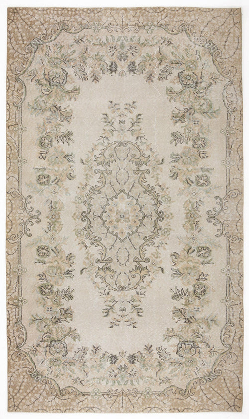 Load image 1 in gallery view. Beige and cream distressed rug with a central floral medallion and ornate border in muted sage and brown tones.