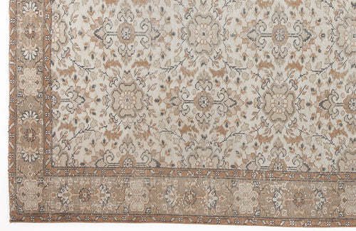 Load image 1 in gallery view. Beige and tan traditional rug with a distressed floral medallion pattern and a wide decorative border.