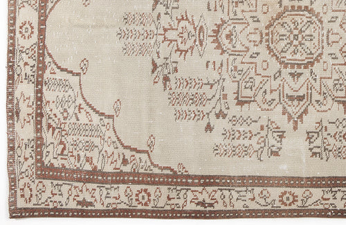 Load image 1 in gallery view. Beige and brown vintage-style rug with a central medallion and intricate geometric border pattern.