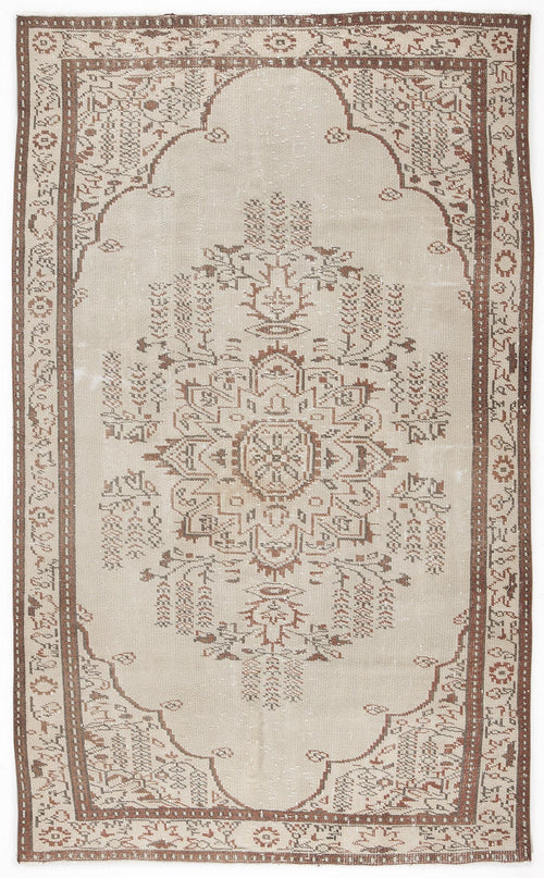 Load image 1 in gallery view. Beige and brown vintage-style rug with a central floral medallion and a decorative geometric border.