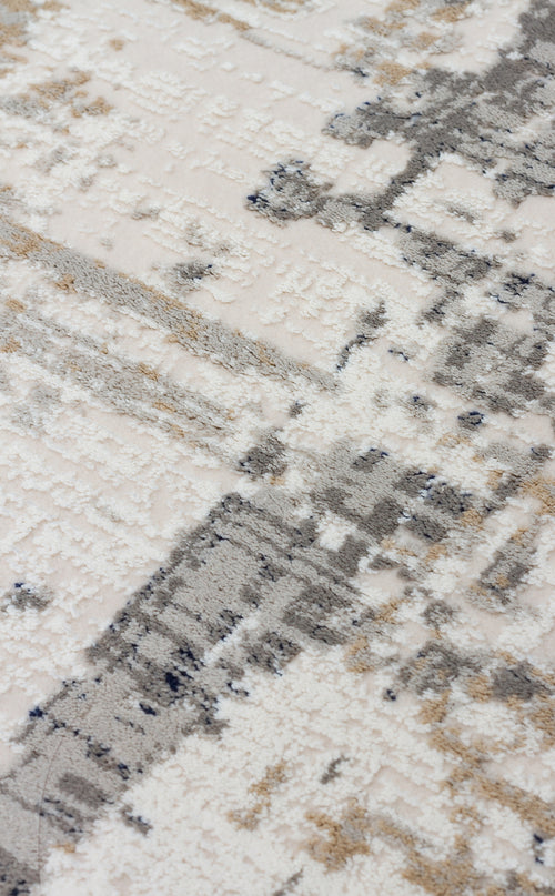 Bild 1 in Galerieansicht laden. Cream, grey, and beige rug with a high-low pile texture and an abstract, distressed geometric pattern.