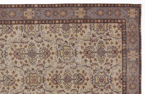 Load image 1 in gallery view. Beige and grey traditional rug with a floral medallion pattern and a dark brown border.