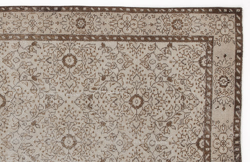Load image 1 in gallery view. Beige and brown rug with a distressed traditional floral medallion pattern and a decorative border.