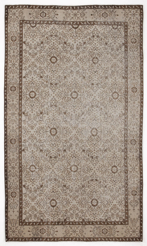 Load image 1 in gallery view. Beige and brown traditional rug with a distressed floral medallion pattern and a wide decorative border.