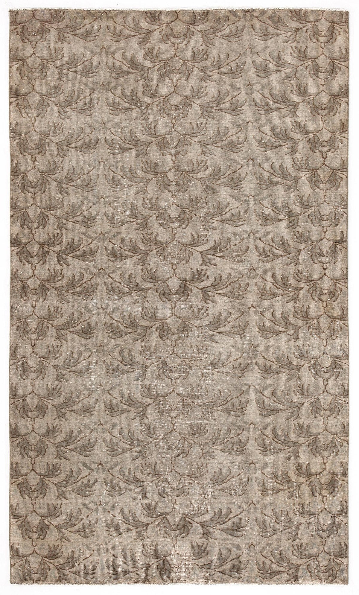 Taupe and beige rug with a repeating symmetrical leaf or feather pattern on a white background.