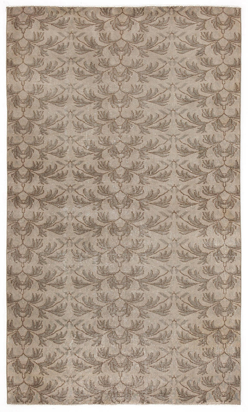 Load image 1 in gallery view. Taupe and beige rug with a repeating symmetrical leaf or feather pattern on a white background.