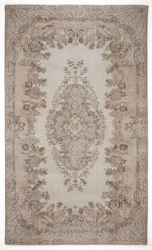 Load image 1 in gallery view. Beige and taupe vintage-style rug with a central floral medallion and ornate border on a white background.