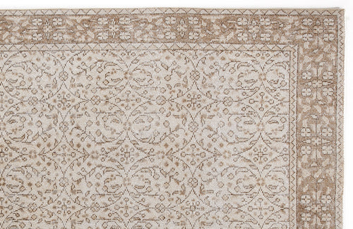 Load image 1 in gallery view. Beige and cream rug with a traditional floral medallion pattern and a detailed botanical border.