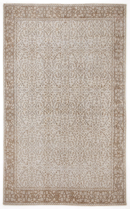 Load image 1 in gallery view. Beige and cream traditional rug with a distressed floral medallion pattern and a wide decorative border.