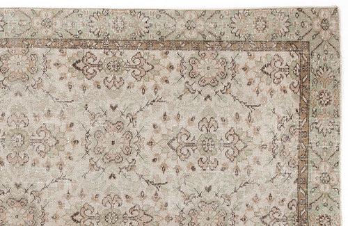 Load image 1 in gallery view. Sage green and beige vintage-style rug with a traditional floral medallion pattern and a decorative border.