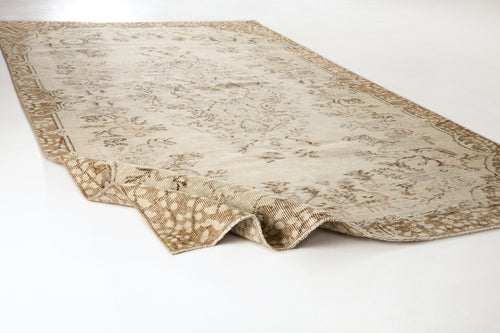 Load image 1 in gallery view. Beige and cream vintage-style rug with a distressed floral medallion pattern on a white background.