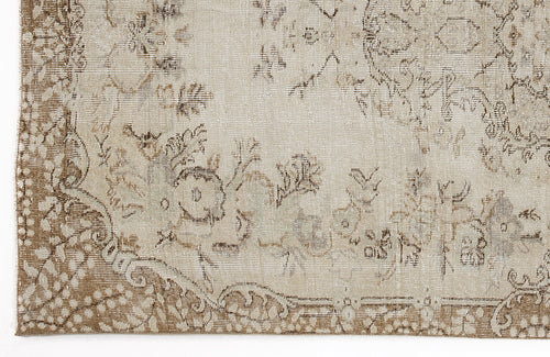 Load image 1 in gallery view. Beige and taupe vintage-style rug with a distressed floral medallion pattern and ornate border.