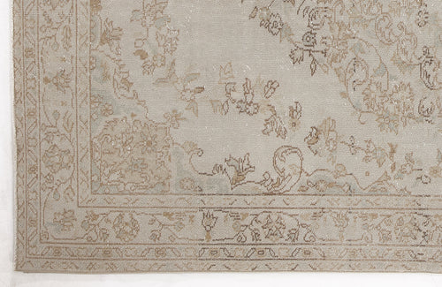 Load image 1 in gallery view. Light beige and taupe rug with a distressed traditional floral medallion pattern and a detailed border.