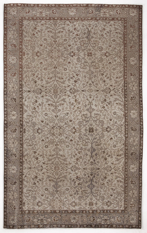 Load image 1 in gallery view. Taupe and brown traditional rug with a distressed floral vine pattern and a decorative border.