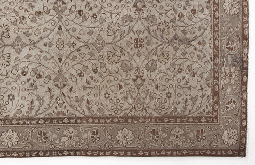 Load image 1 in gallery view. Taupe and brown rug with a traditional floral vine pattern and a decorative border.