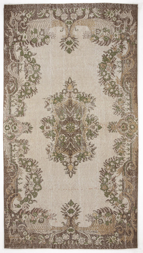 Load image 1 in gallery view. Beige, brown, and sage green vintage-style rug with a central floral medallion and ornate botanical border.