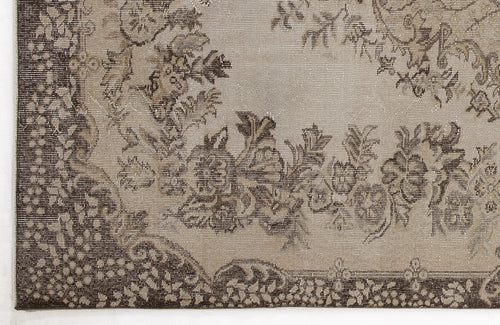 Load image 1 in gallery view. Taupe and dark brown rug with a distressed floral medallion pattern and ornate border.