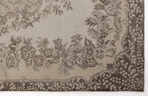 Load image 1 in gallery view. Taupe and dark brown rug with a distressed floral medallion pattern and a detailed decorative border.