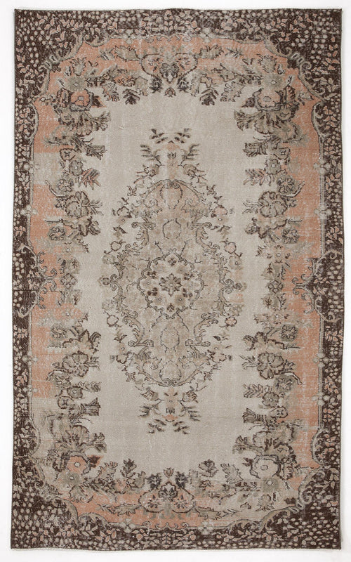 Load image 1 in gallery view. Distressed beige, brown, and muted peach rug with a central floral medallion and ornate botanical border.