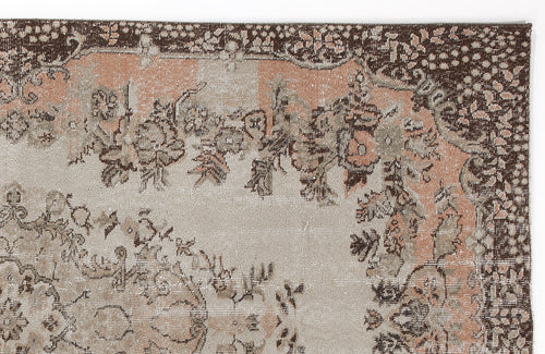 Load image 1 in gallery view. Distressed brown, peach, and beige rug with a traditional floral medallion pattern on a white background.