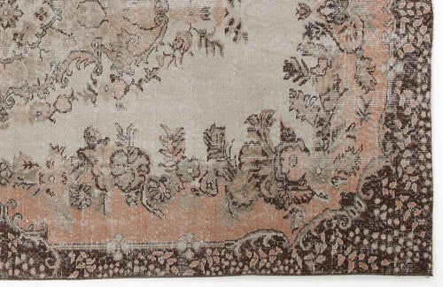 Load image 1 in gallery view. Distressed beige, peach, and dark brown rug with a traditional floral medallion pattern and ornate border.